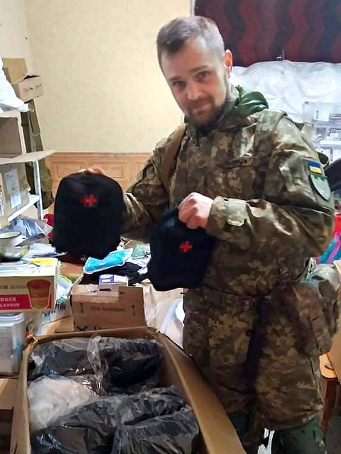 Ukrainian soldier with medical kits