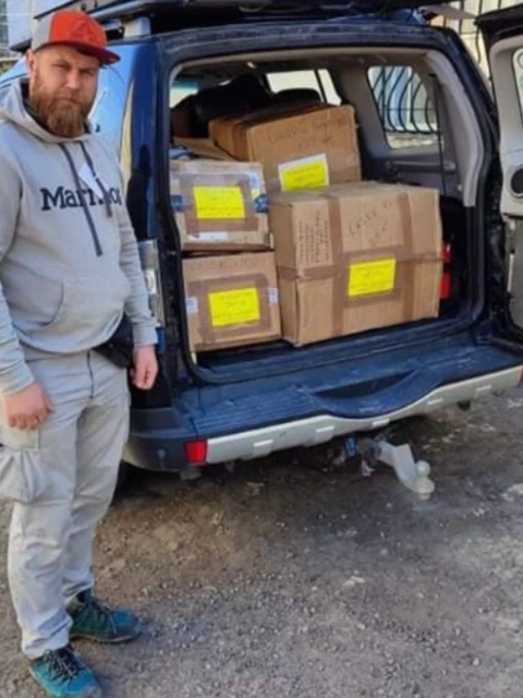 Ukrainian volunteer with humanitarian shipment